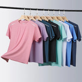 Woman wearing reflective running T-shirt made of breathable elastic silk – ideal for fitness, yoga, and outdoor workouts